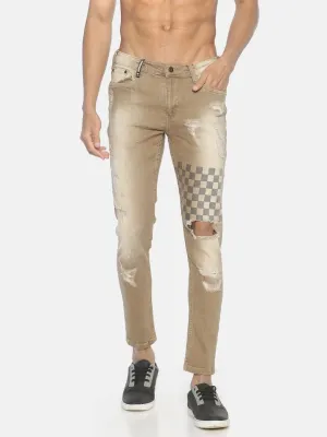 Beige ripped printed denim jeans