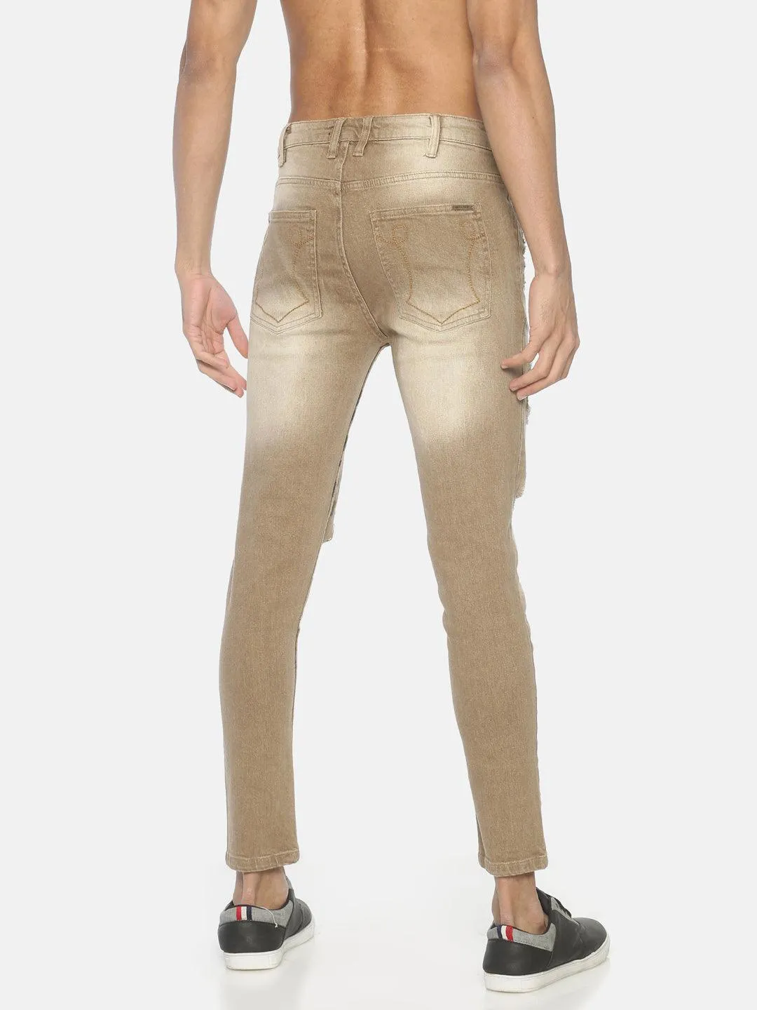 Beige ripped printed denim jeans